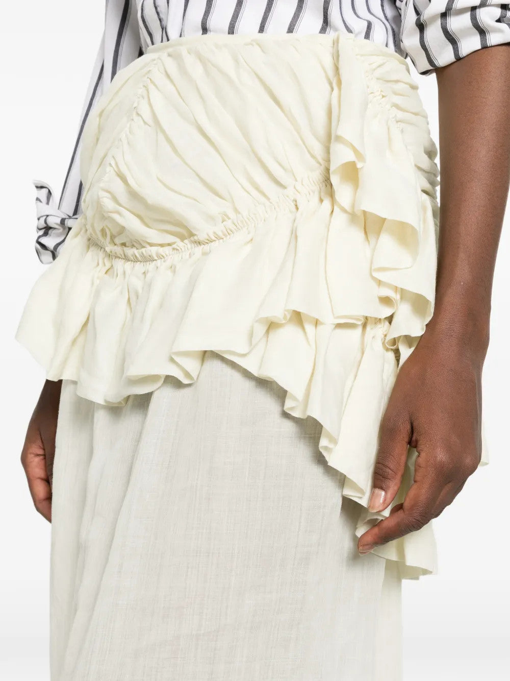Tan skirt worn by a person, showing the skirt fit