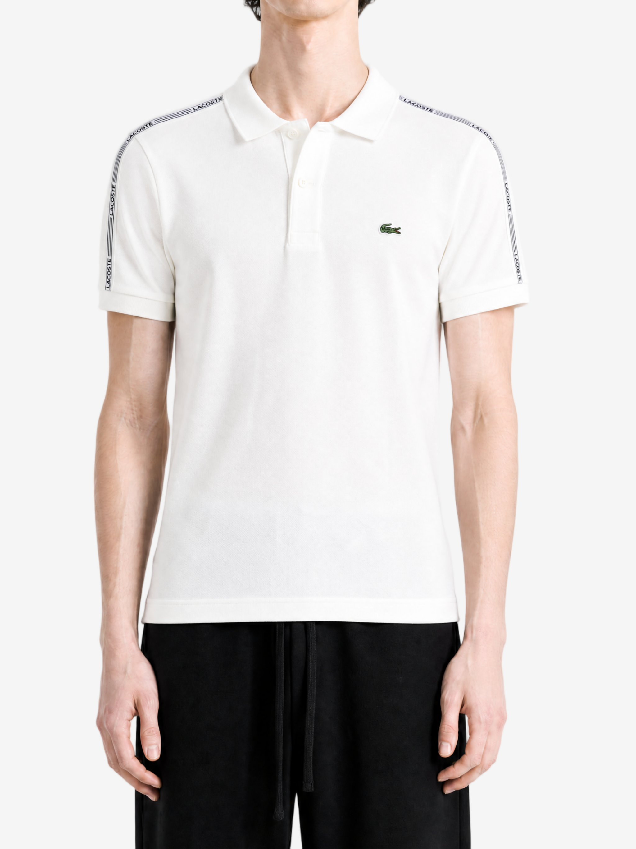 White shirt worn by a person, showing the shirt fit