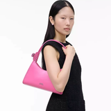 Pink bag worn by a person, showing the bag's fit