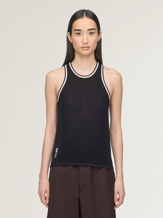 Black top worn by a person, showing the top fit