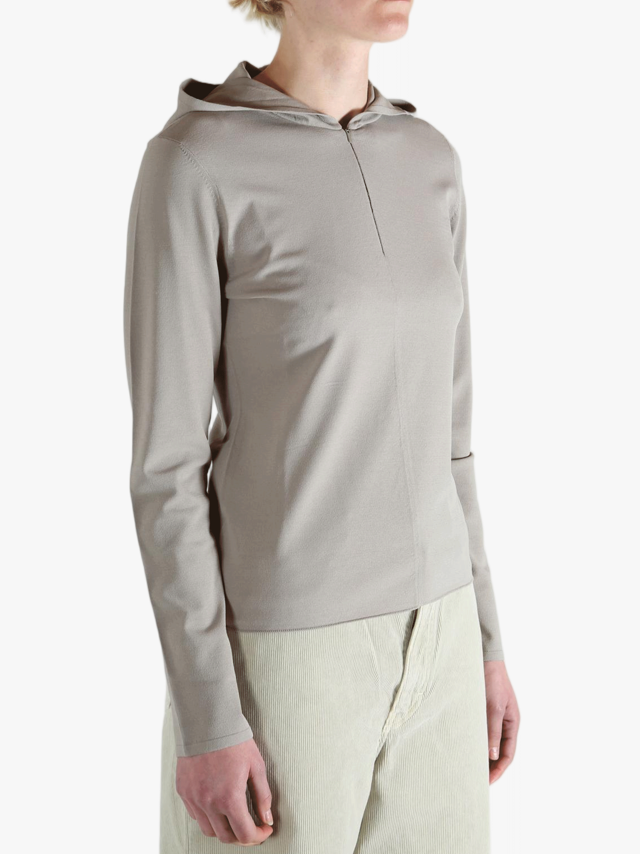 Grey knitwear worn by a person, showing the knitwear fit