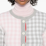 Close up of the grey knitwear, showing texture of the wool fabric