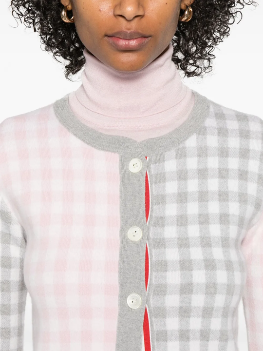 Close up of the grey knitwear, showing texture of the wool fabric