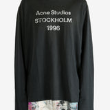 Black t-shirt worn by a person, showing the t-shirt's fit