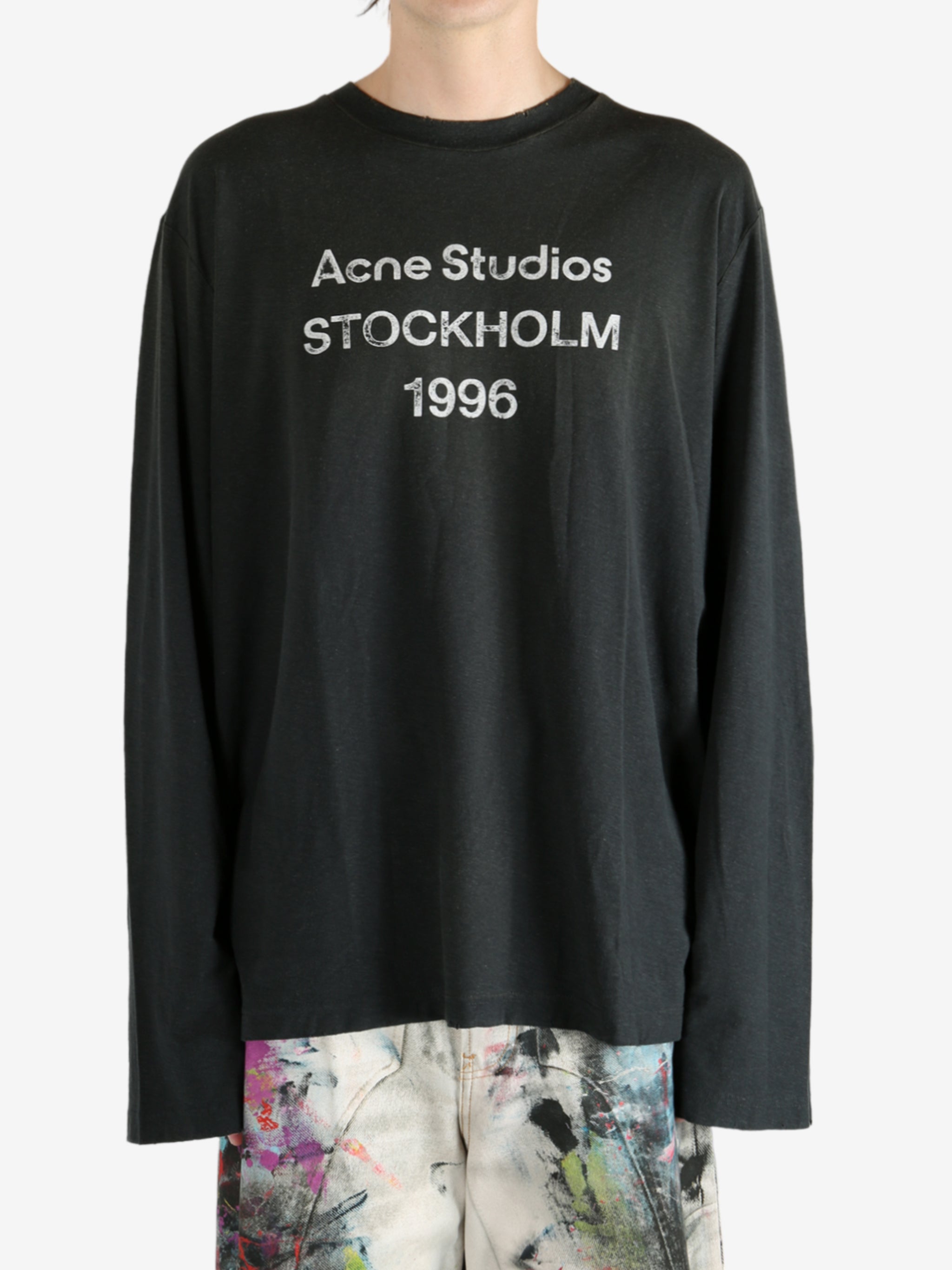 Black t-shirt worn by a person, showing the t-shirt's fit