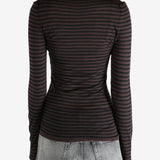 Brown top worn by a person, showing the top's fit