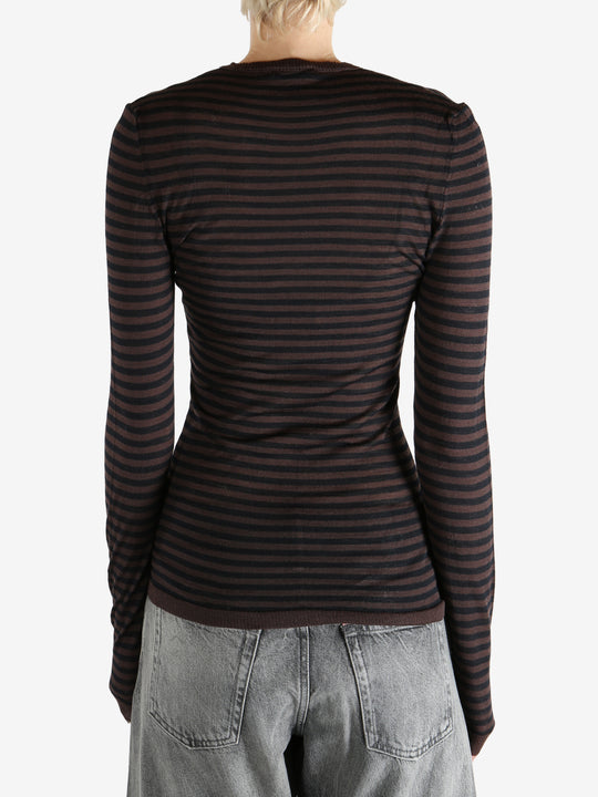 Brown top worn by a person, showing the top's fit