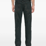 Black jeans worn by a person, showing the jeans fit