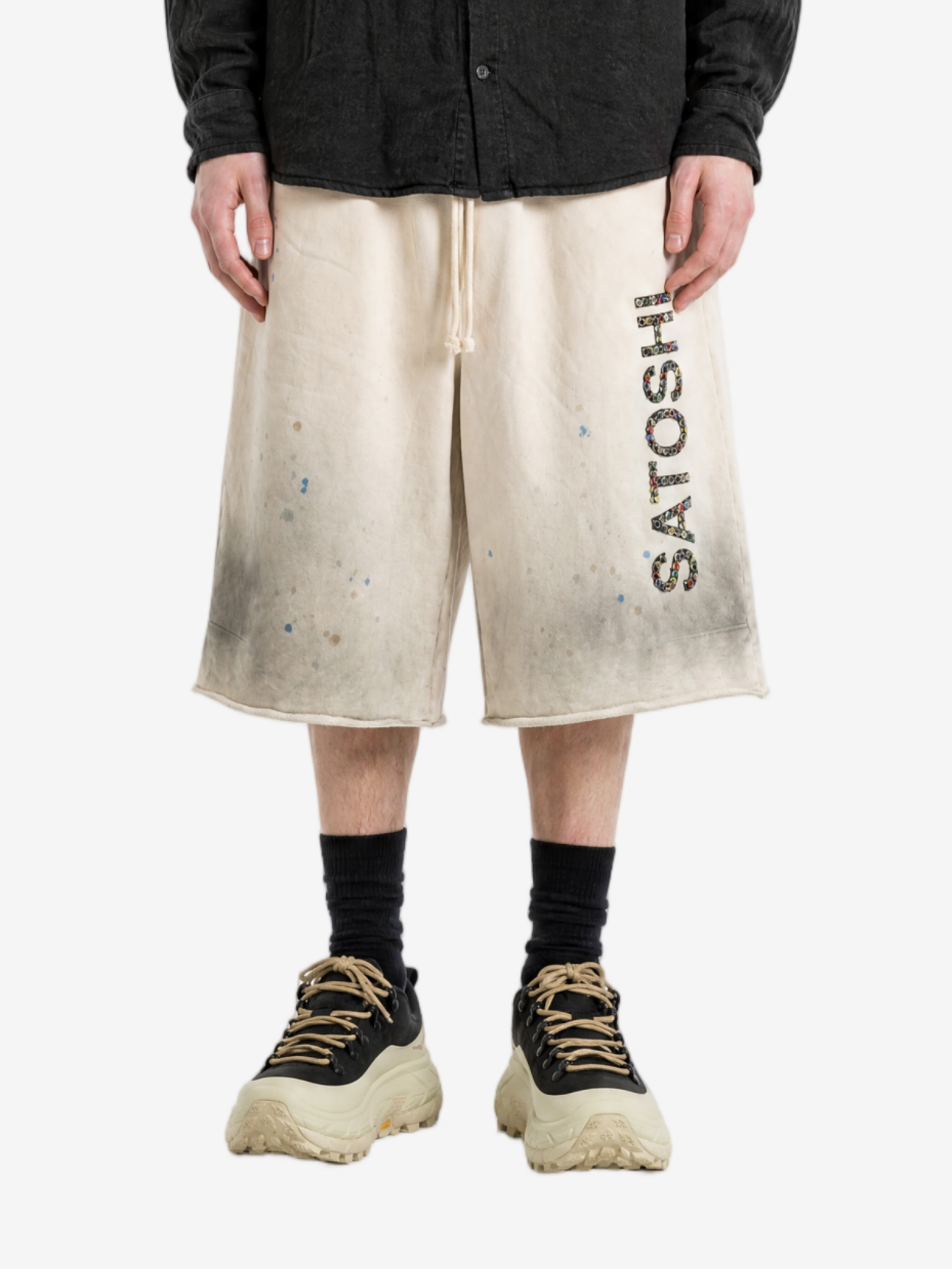 Tan shorts, full body view