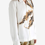 White shirt worn by a person, showing the shirt's fit