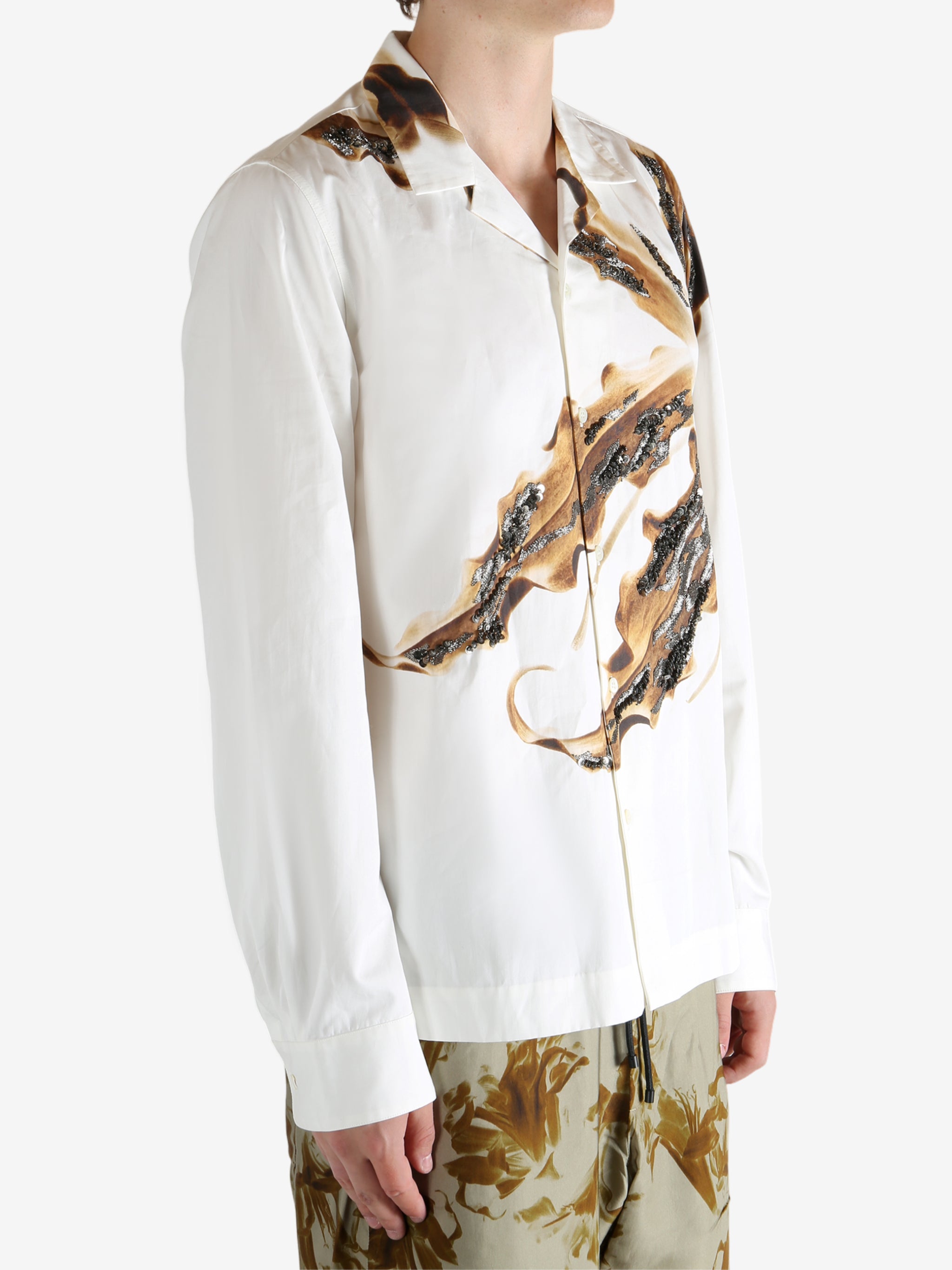 White shirt worn by a person, showing the shirt's fit