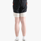 Black pants worn by a person, showing the pants's fit
