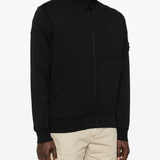 Black jacket worn by a person, showing the jacket fit