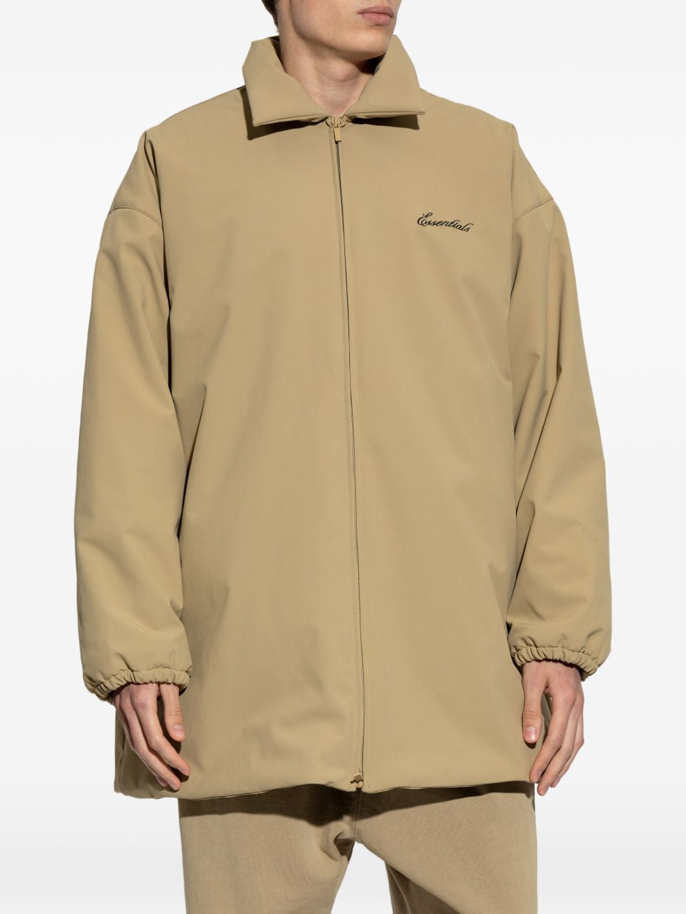 Tan jacket worn by a person, showing the jacket's fit