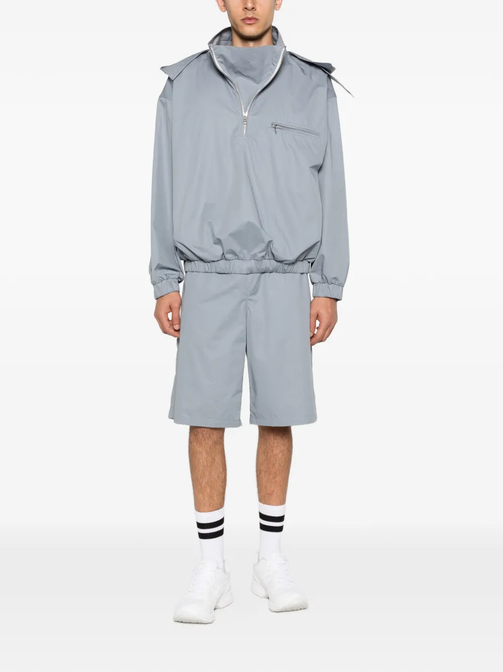Grey windbreaker, full body view