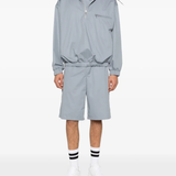 Grey windbreaker, full body view