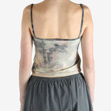 Grey top worn by a person, showing the fit