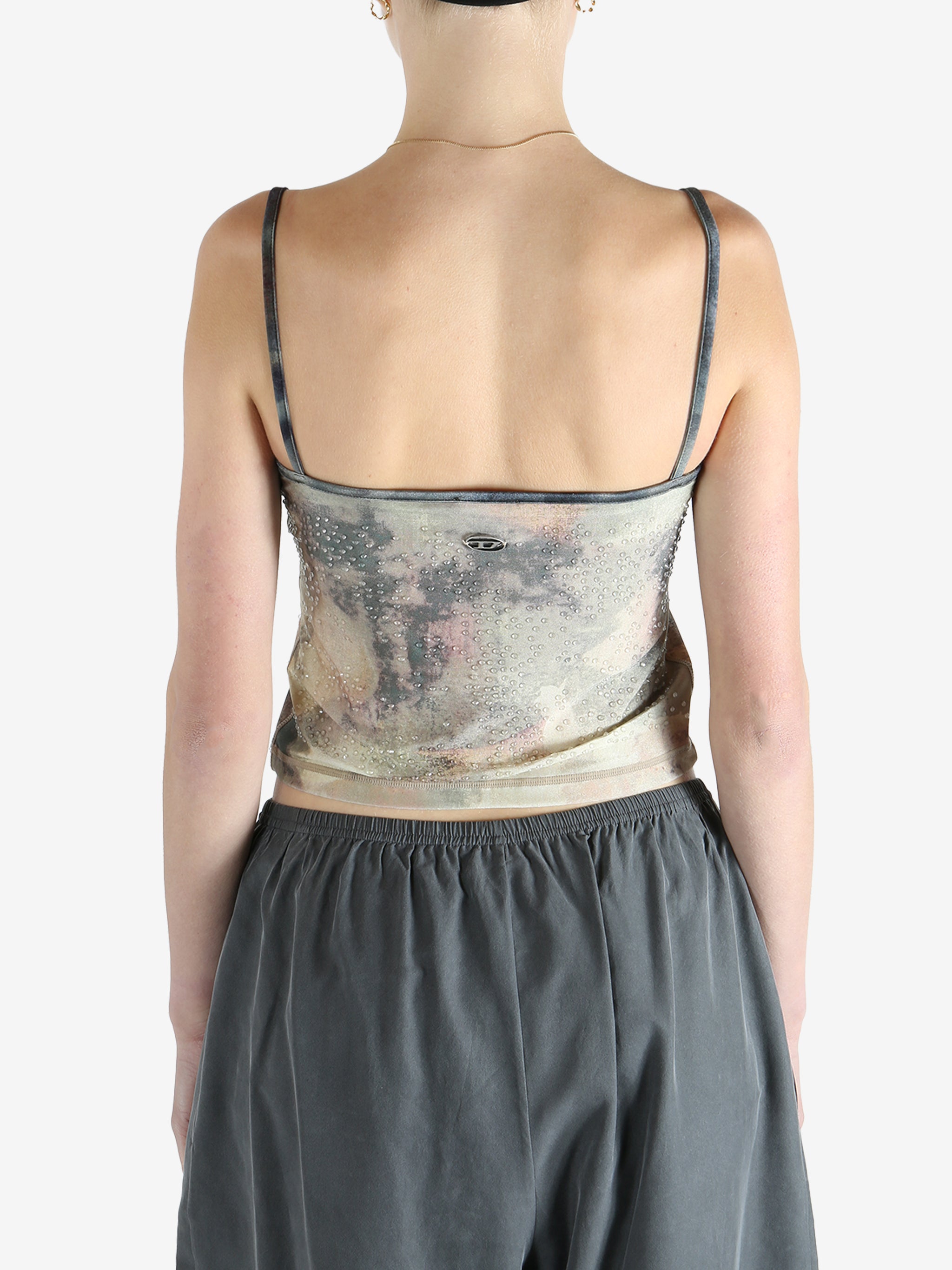 Grey top worn by a person, showing the fit