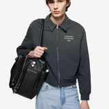 Black hoodie worn by a person, showing the hoodie fit