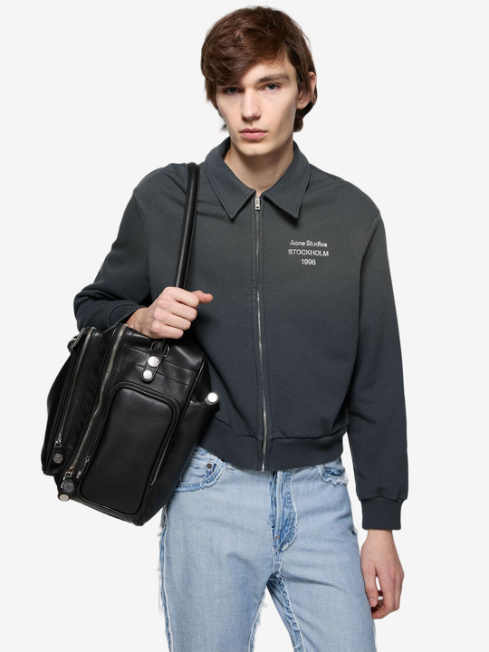 Black hoodie worn by a person, showing the hoodie fit