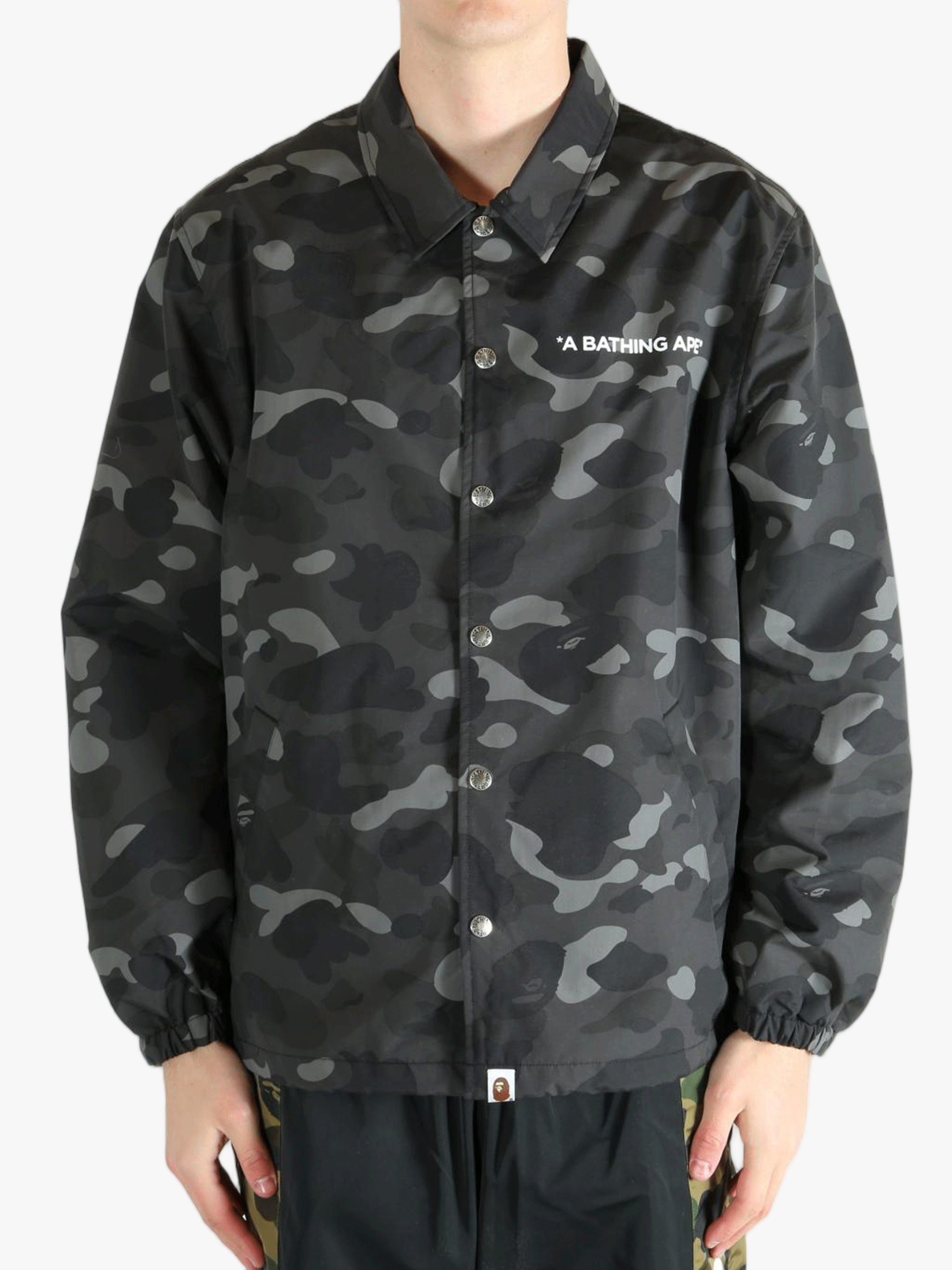 Black jacket worn by a person, showing the jacket's fit