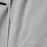 Cloes-up of grey pants, showing texture of the cotton fabric