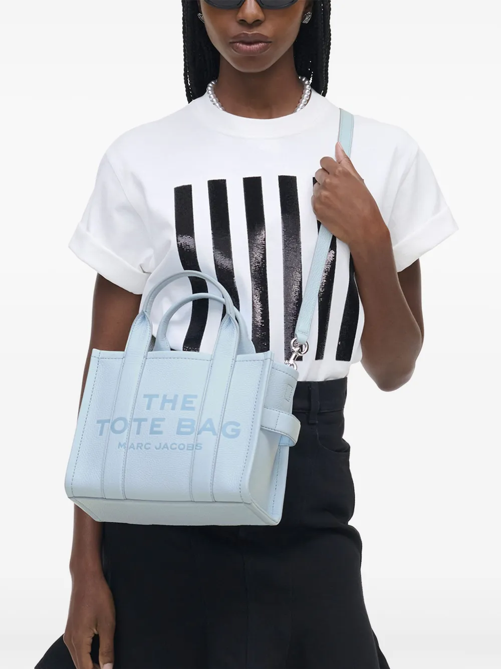 Blue bag worn by a person, showing the bag's fit