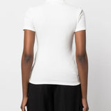 White shirt worn by a person, showing the shirt's fit