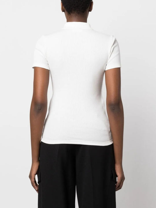 White shirt worn by a person, showing the shirt's fit