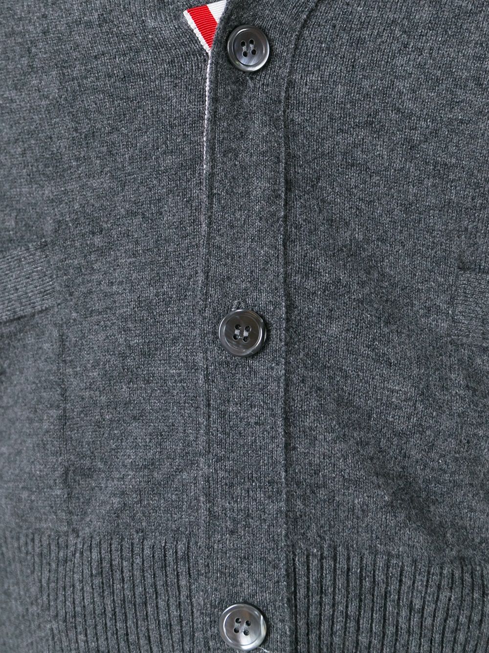 Close up of grey knitwear, showing texture of the cashmere fabric