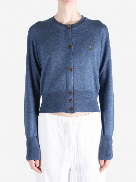 Blue knitwear worn by a person, showing the knitwear fit