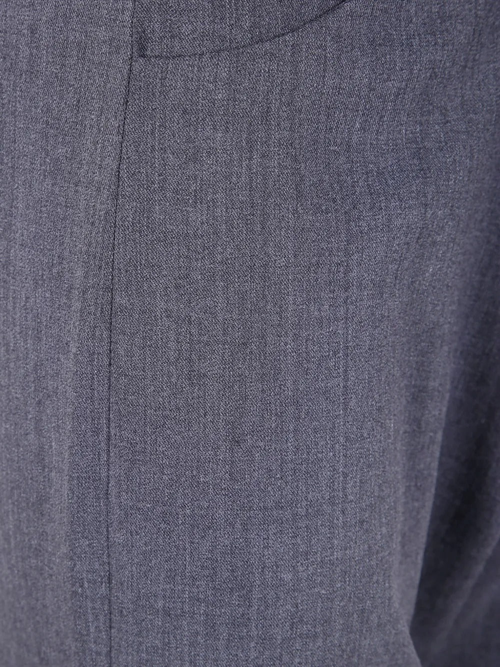 Close up of gray pants, showing texture of the polyester fabric