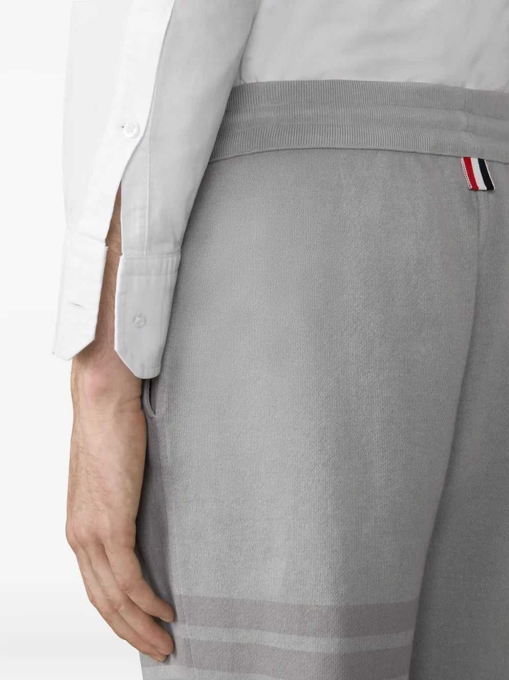 Close up of grey pants, showing texture of the cotton fabric