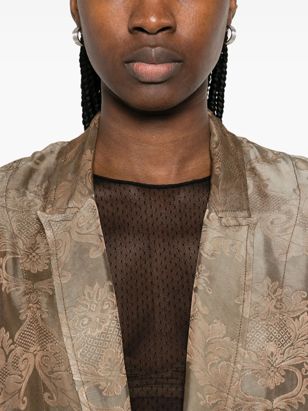 Close up of brown coat,showing texture of the cotton fabric.