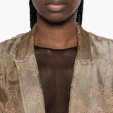 Close up of brown coat,showing texture of the cotton fabric.