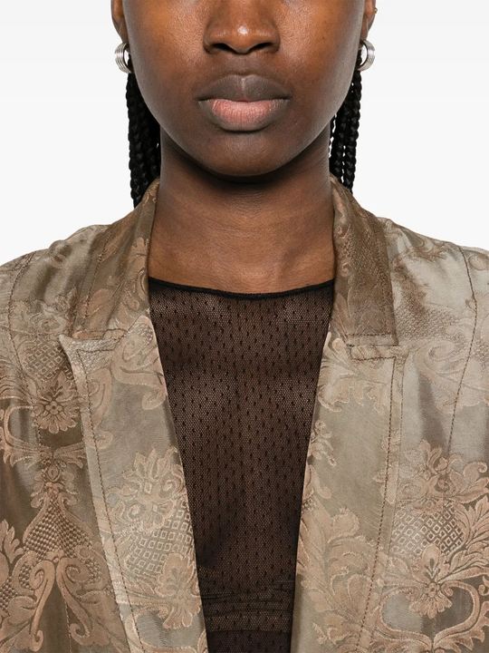 Close up of brown coat,showing texture of the cotton fabric.