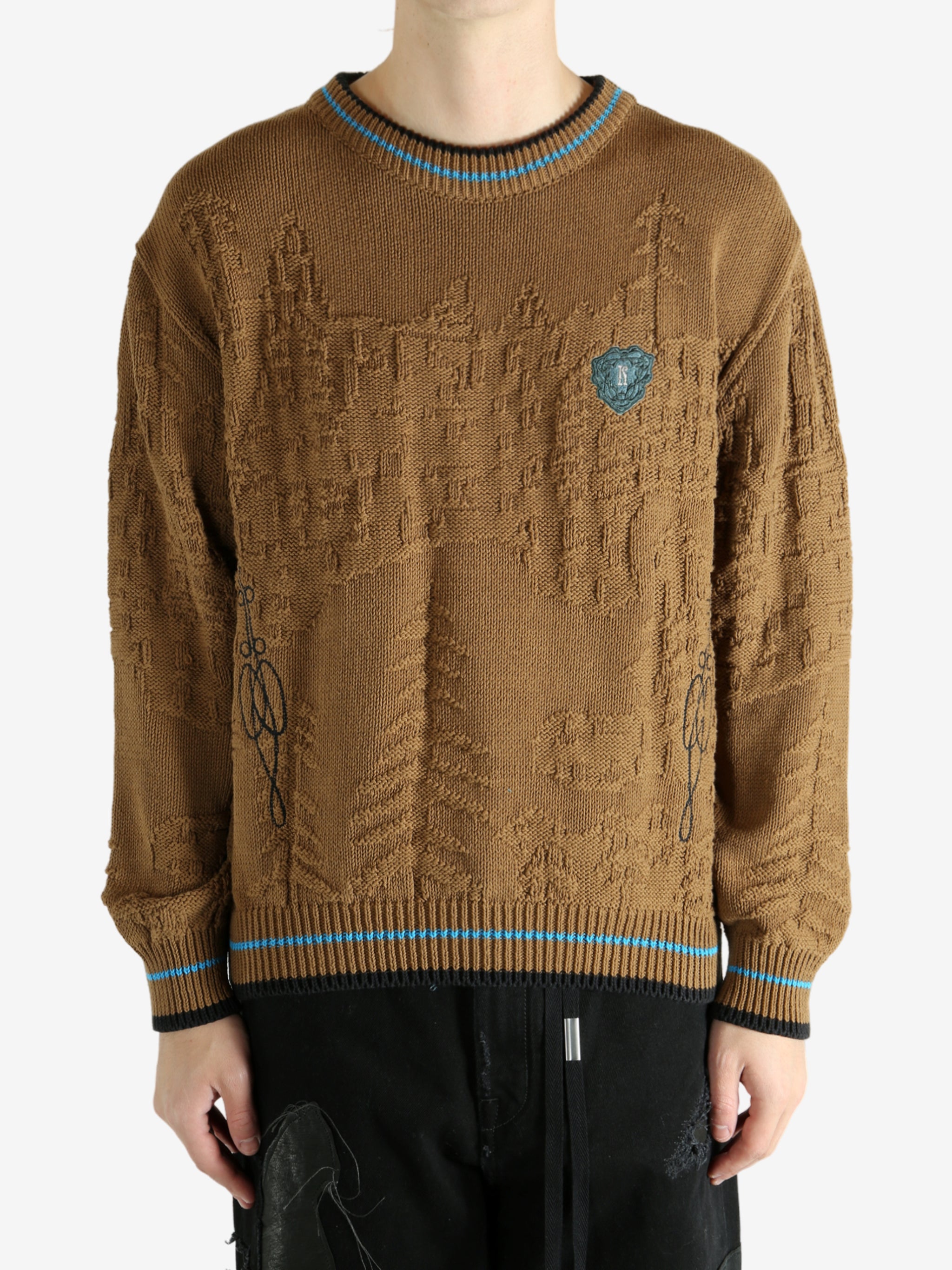 Brown jumper worn by a person, showing the jumper's fit