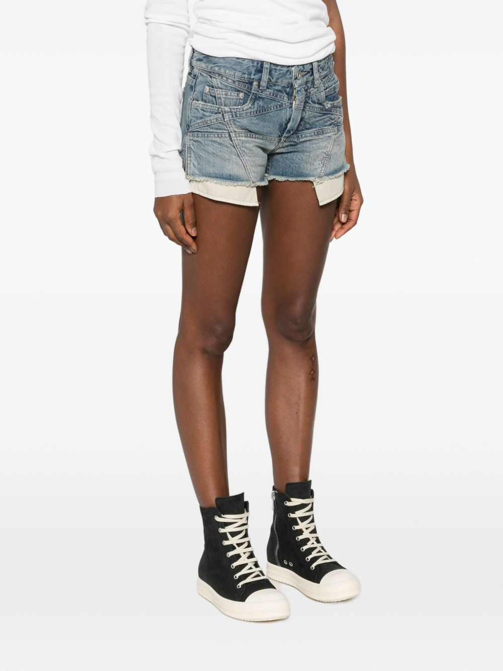 Blue shorts worn by a person, showing the shorts fit