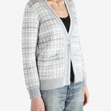 Grey knitwear worn by a person, showing the cotton fit