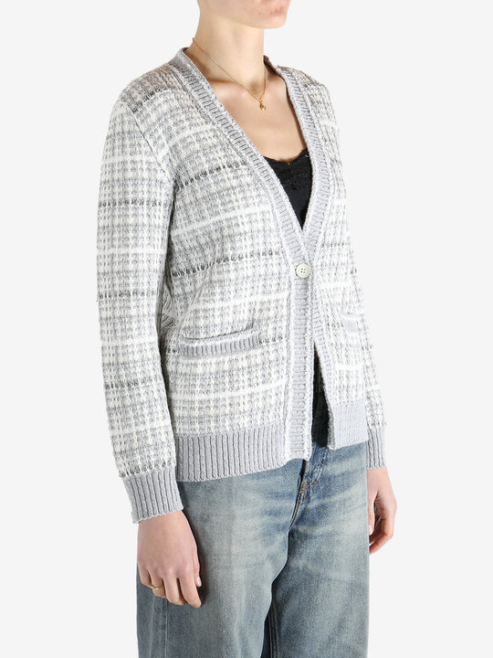 Grey knitwear worn by a person, showing the cotton fit