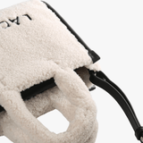 Close up of tan bag, showing texture of the Polyester fabric