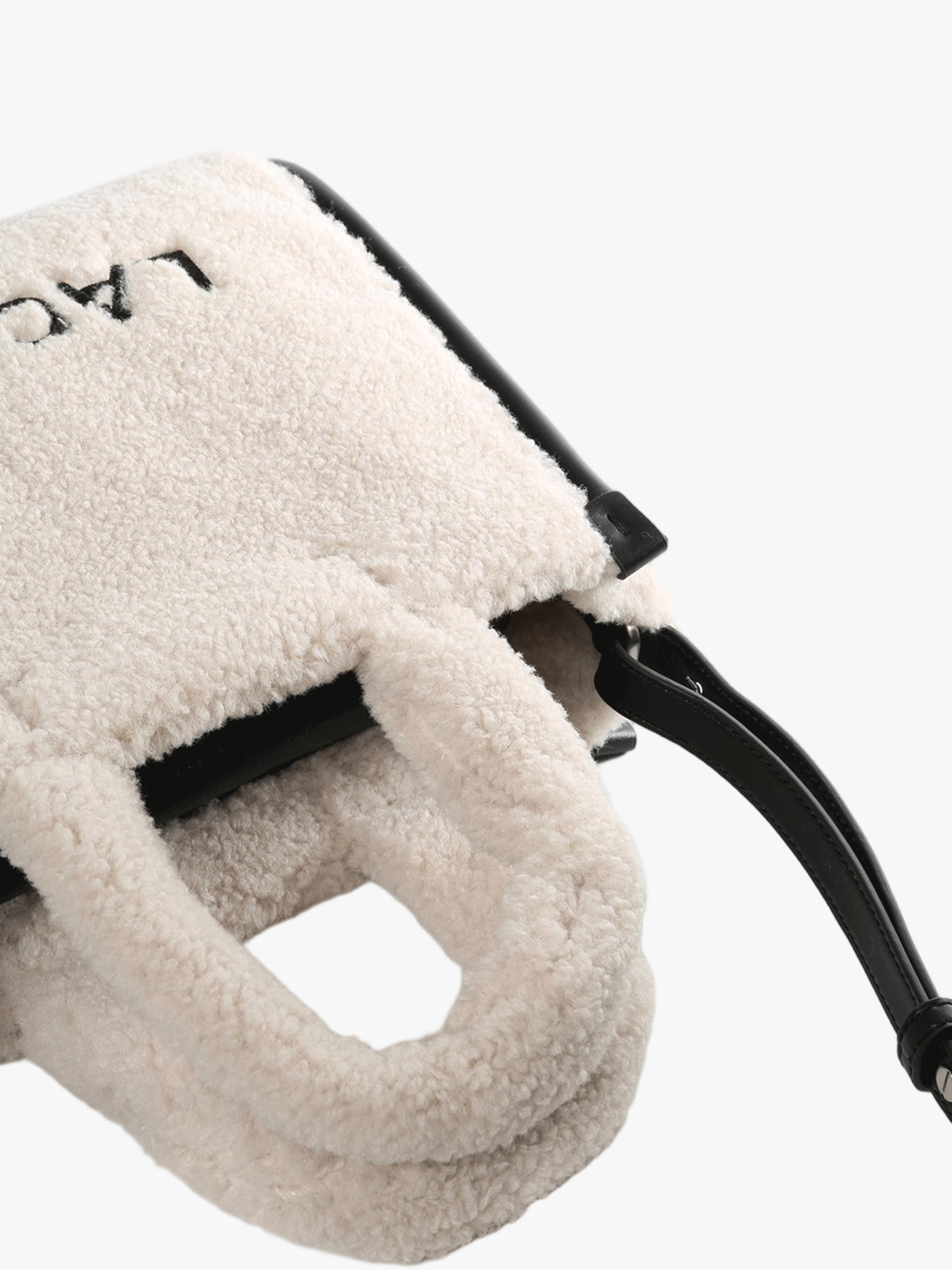 Close up of tan bag, showing texture of the Polyester fabric