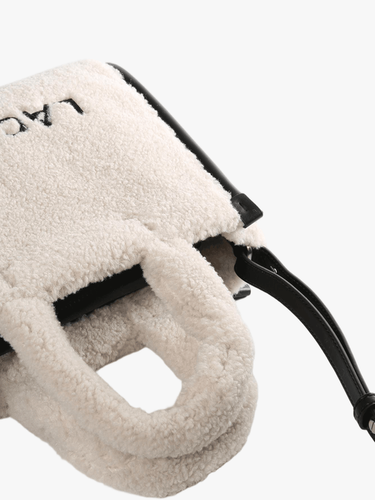 Close up of tan bag, showing texture of the Polyester fabric