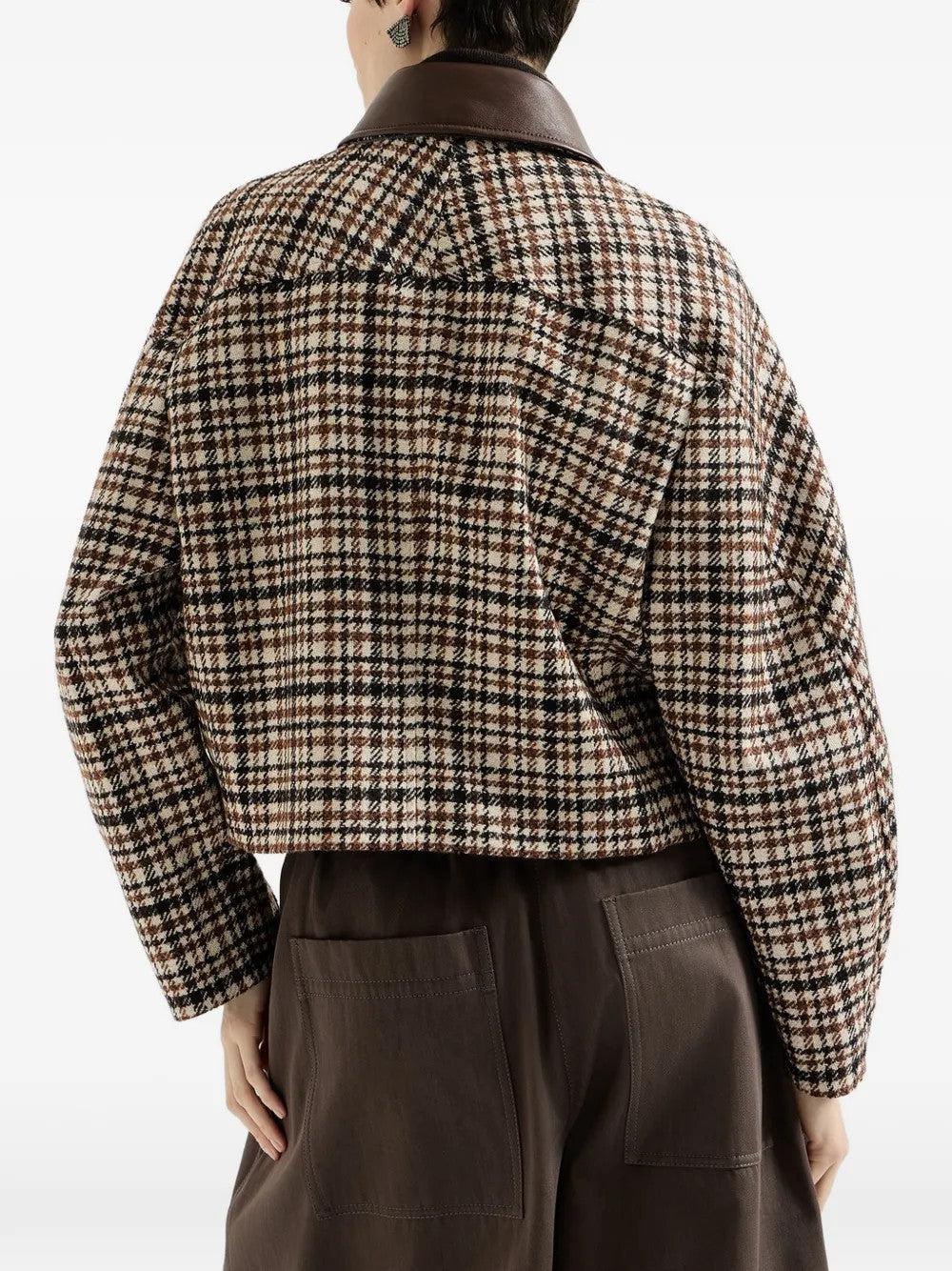 Brown jacket worn by a person, showing the jacket fit