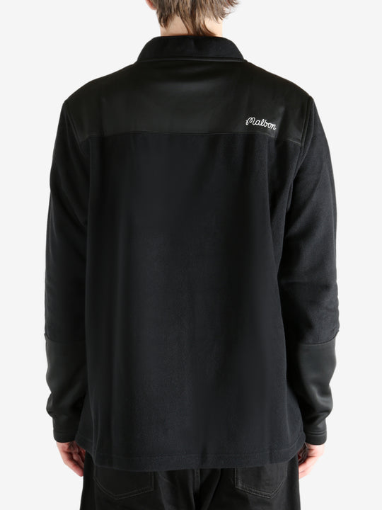 Black sweatshirt worn by a person, showing the sweatshirt's fit