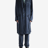 Navy coat worn by a person, showing the coat's fit