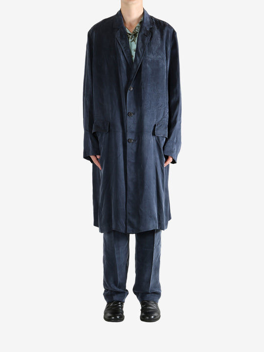 Navy coat worn by a person, showing the coat's fit