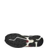 Close up of blue sneakers, showing texture of the rubber fabric