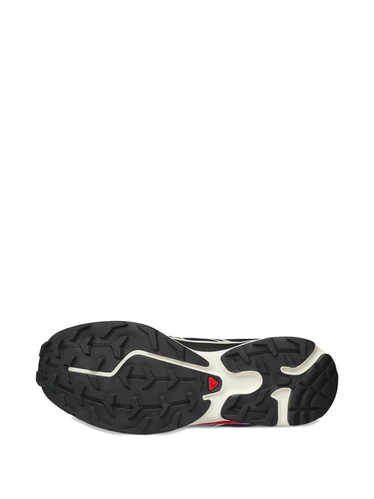 Close up of blue sneakers, showing texture of the rubber fabric