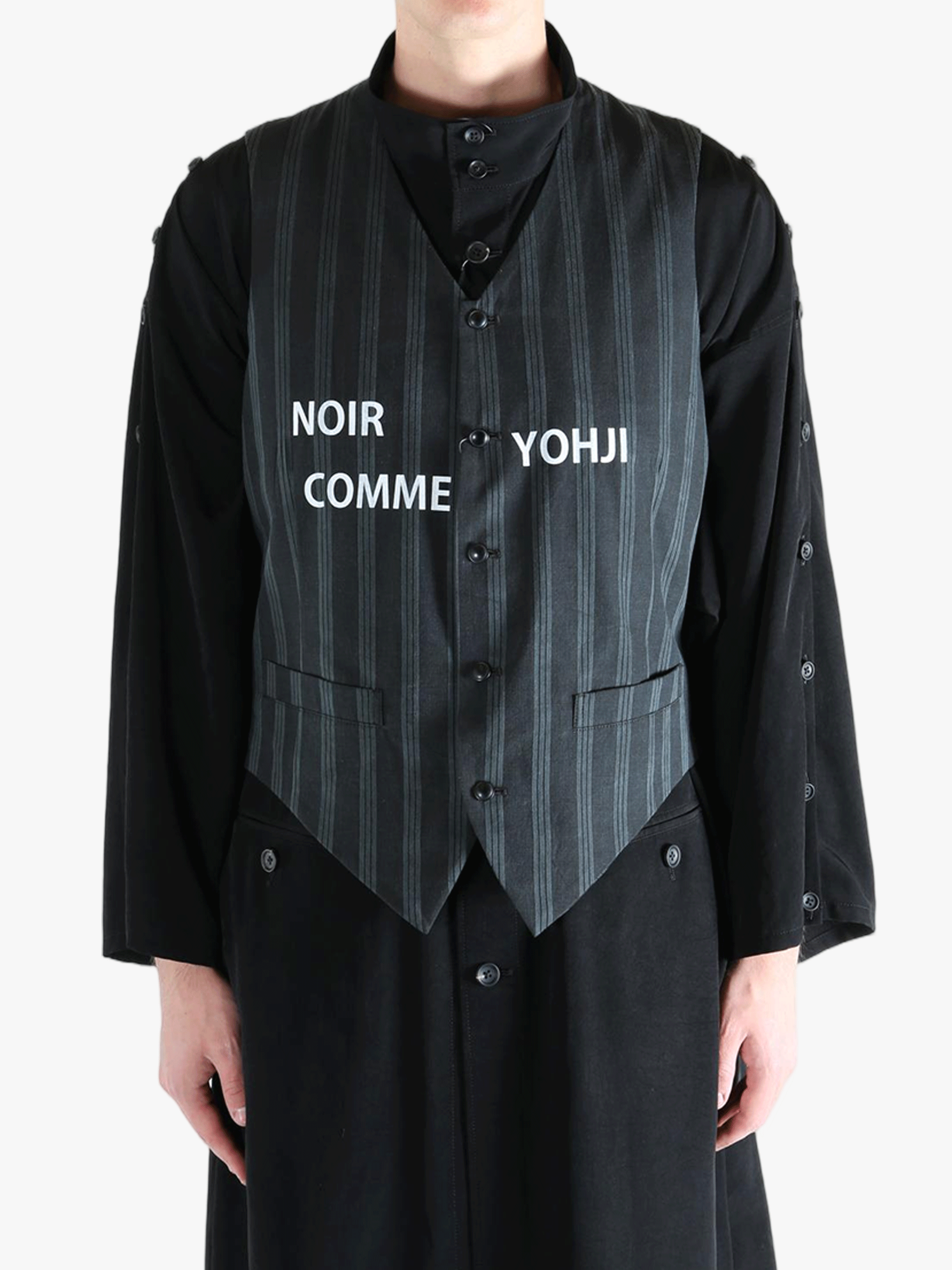 Black vest worn by a person, showing the vest's fit